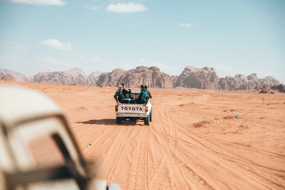 Free Photo of People Riding on Pickup Truck Stock Photo